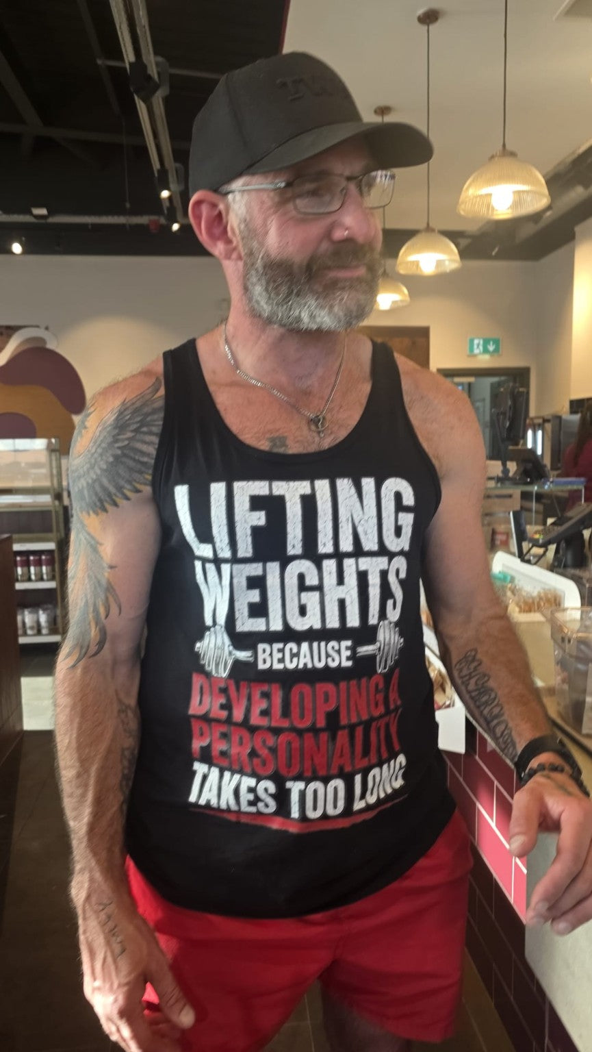 The Wandering Manc founder wearing the Lifting Weights Because Developing a Personality Takes Too Long tank top