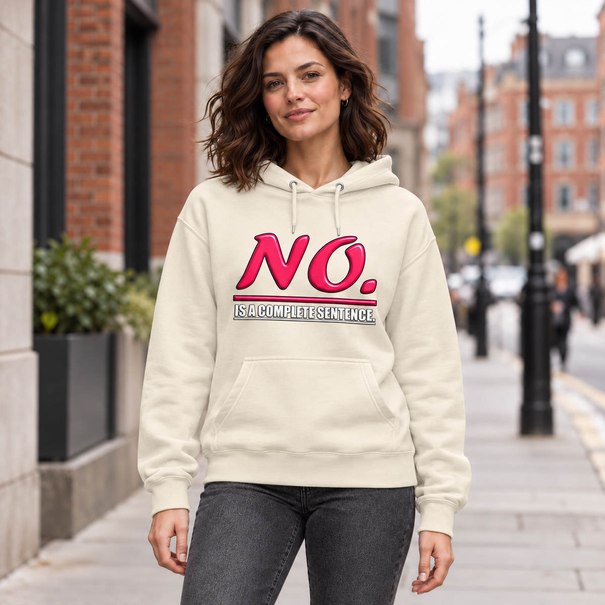 Bone unisex pullover hoodie with glossy pink “NO.” lettering and white “IS A COMPLETE SENTENCE.” slogan.
