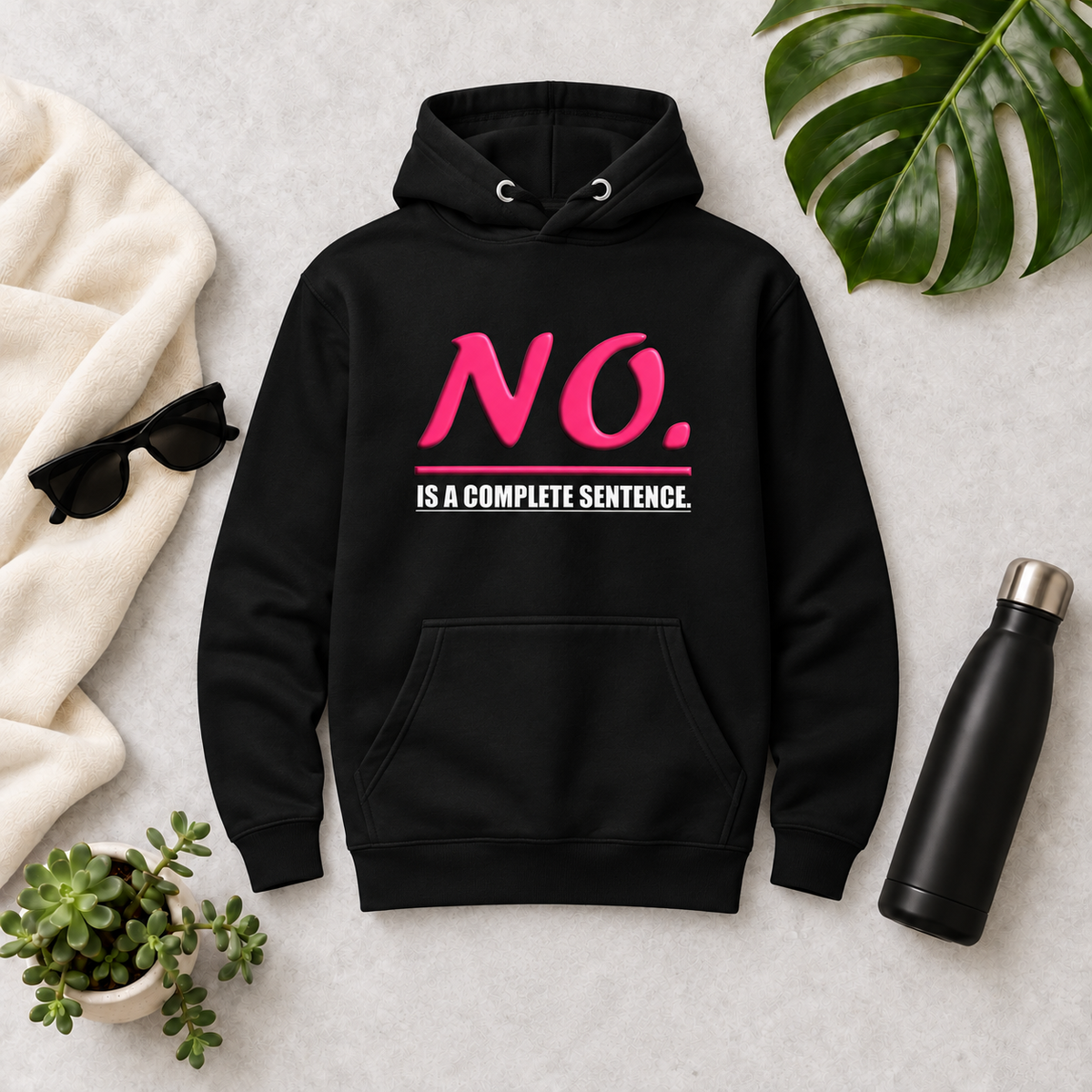 Black unisex pullover hoodie with glossy pink “NO.” lettering and white “IS A COMPLETE SENTENCE.” slogan.